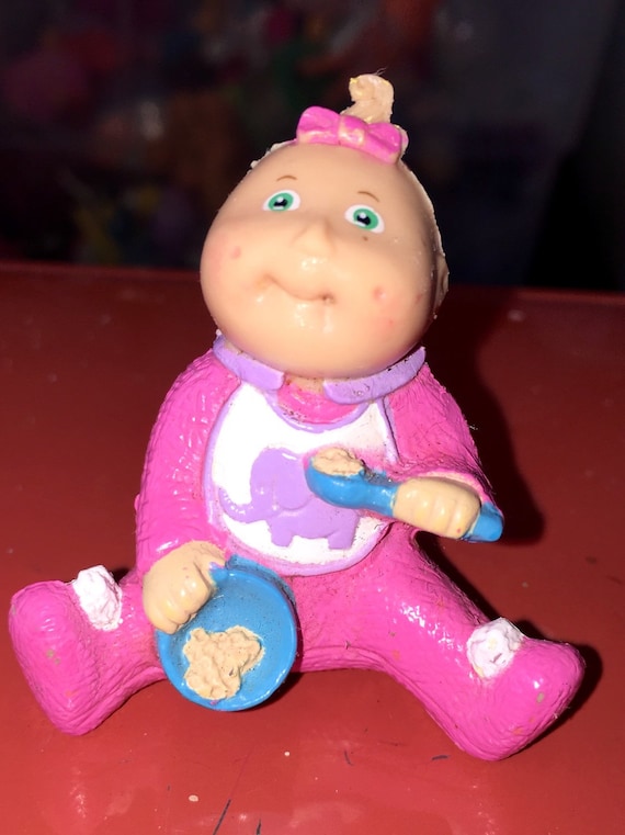 cabbage patch kid eats food