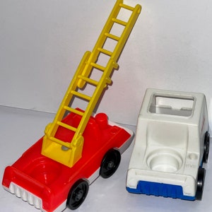 May include: A red and white fire truck with a yellow ladder and a white and blue van. Both vehicles have black wheels.