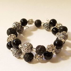 Pulsera Stim de textura de alambre de memoria negra y plateada