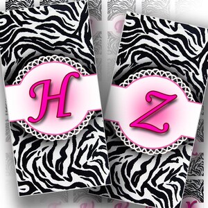 May include: Two rectangular cards with a zebra print background. Each card features a pink circle with a white scalloped border and a hot pink letter. One card has the letter "H", the other has the letter "Z".
