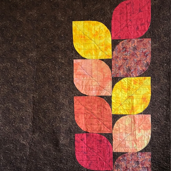 Leaf quilt; modern quilt in autumn colors: dark brown, yellow, red, and orange