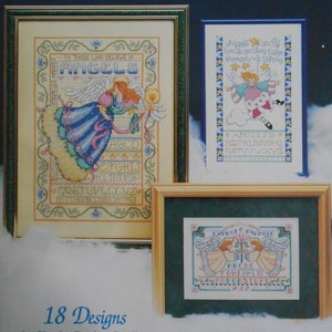 May include: A collection of 18 cross stitch patterns featuring angels. The patterns include alphabets, inspirational quotes, and images of angels. The title of the collection is "Angel Samplers".