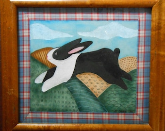 May include: A black and white rabbit hops across a green and brown landscape with a blue sky and white clouds in the background. The rabbit is painted in a whimsical style with a simple, cartoonish look.