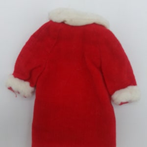 May include: Red coat with white fur trim around the collar and cuffs.
