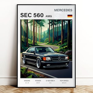 May include: A framed print featuring a black Mercedes SEC 560 AMG car driving on a winding road through a forest. The print includes the text "SEC 560 AMG" and "MERCEDES". The car's engine is 6.0L V8, with 385 HP, 0-100 km/h in 5.9 seconds, and a top speed of 290 km/h.