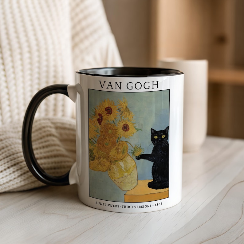 May include: White ceramic mug with a black handle and rim, featuring a print of Van Gogh's "Sunflowers" painting and a black cat. The mug includes the text "VAN GOGH" and "SUNFLOWERS (THIRD VERSION) - 1888".