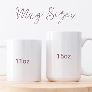 May include: Two white ceramic mugs of different sizes are displayed on a wooden surface. The smaller mug is labeled "11oz" and the larger mug is labeled "15oz". The words "Mug Sizes" are written in a cursive font above the mugs.