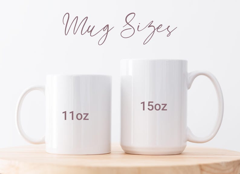 May include: Two white ceramic mugs of different sizes are displayed on a wooden surface. The smaller mug is labeled "11oz" and the larger mug is labeled "15oz". The words "Mug Sizes" are written in a cursive font above the mugs.