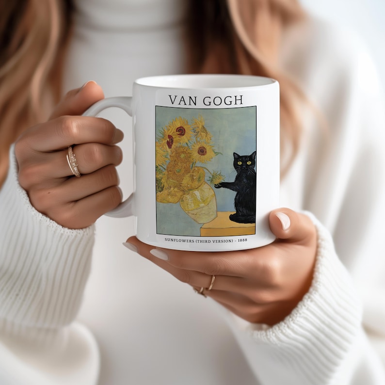 May include: White ceramic mug featuring a print of Van Gogh's "Sunflowers (Third Version)" painting, with a black cat. The mug has the text "VAN GOGH" at the top and "SUNFLOWERS (THIRD VERSION) - 1888" at the bottom.
