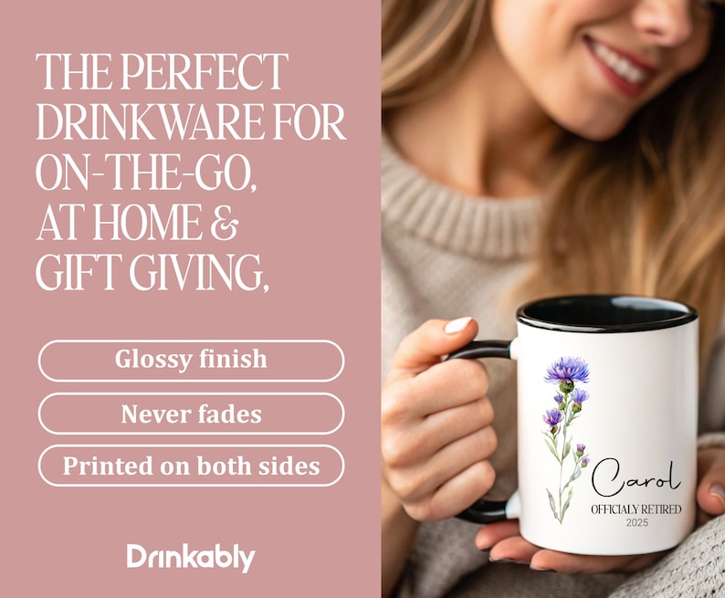 May include: White ceramic mug with a black rim and handle, featuring a watercolor thistle design and the name "Carol" with "OFFICIALLY RETIRED 2025." The mug has a glossy finish and is printed on both sides.