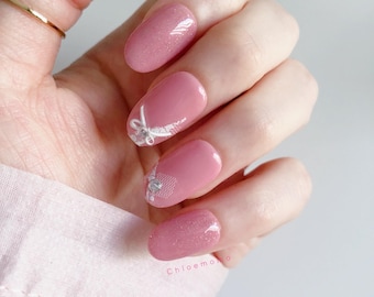Handgefertigte künstliche Fingernägel mit rosa Schleife und Strass-Schleife
