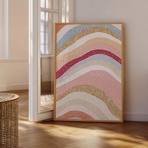 May include: A rectangular framed wall art piece featuring a series of wavy, horizontal bands in various glittery textures and colors, including light blue, gold, deep pink, soft pink, and coral, all set against a white background.