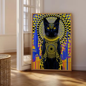 May include: A rectangular framed wall art print featuring a stylized black cat with bright yellow eyes, centered against a vibrant yellow and blue geometric sunburst pattern, with a blue city skyline silhouette at the base of the composition.