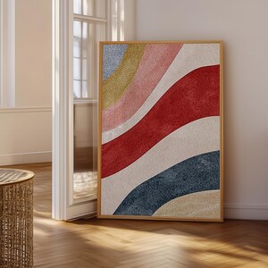 May include: A rectangular wall art piece in a light wood frame featuring a textured abstract design with sweeping, curved bands of color. The composition includes layers of light blue, mustard yellow, soft pink, deep red, and dark navy blue.