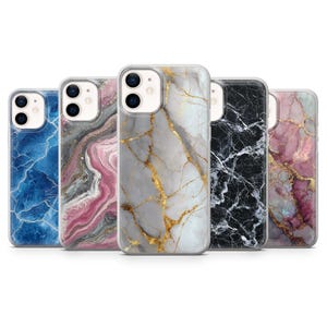 May include: A collection of five smartphone cases with marble designs. The cases feature various colors, including blue, pink, gray, white, and black, with gold veining. Each case has a clear border and a camera cutout.