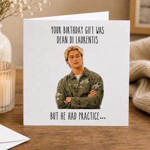 May include: A white greeting card featuring a digital illustration of a person with blonde hair wearing a green camouflage jacket. The text reads: YOUR BIRTHDAY GIFT WAS DEAN DI LAURENTIS BUT HE HAD PRACTICE...