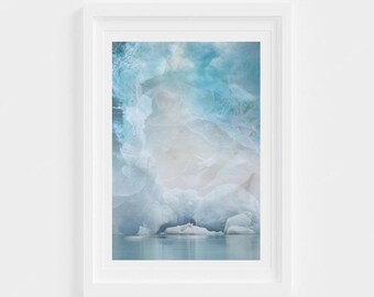May include: A photograph of a glacial ice cave with a blue and white color scheme. The ice is smooth and textured, and the light shines through the ice, creating a soft, ethereal glow.