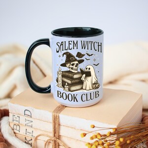 Salem Which Book Club Mug with Halloween ghost, with spooky design on white ceramic cup with black handle accent