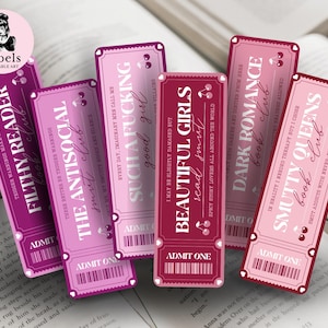 May include: Six ticket-style bookmarks in pink and burgundy, featuring book club themes and quotes. They are displayed on an open book, with the Arbels Printable Art logo visible. The bookmarks have a vintage aesthetic.