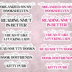 May include: A collection of stickers with various phrases in black and pink, including "Organized on my bookshelves" and "Reading smut is better." The stickers have a white border and are on a light pink background.