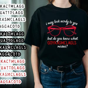 May include: Black t-shirt with the text "i may look nerdy to you but do you know what GOYKASMCLAGLS means?" and red glasses graphic. The shirt also has multiple stickers with text.