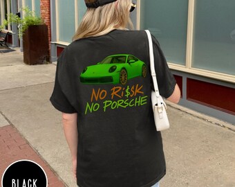 May include: Black t-shirt with a green sports car graphic and the text "No Risk No Porsche" in orange and gold. The shirt is a casual style, suitable for everyday wear.