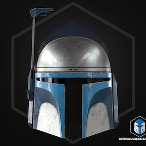 May include: A detailed image of a Mandalorian helmet. The helmet has a silver dome, blue accents, and a T-shaped visor. A vertical antenna extends from the top. The background is dark with a hexagonal outline.