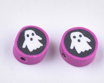 May include: Two purple round beads with a black circle and a white ghost design.