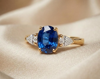Gouden ovale ring met blauwe saffier, verstelbare ring met delicate steen, elegant damessieraad, minimalistische verlovingsring, geboortesteen cadeau voor haar
