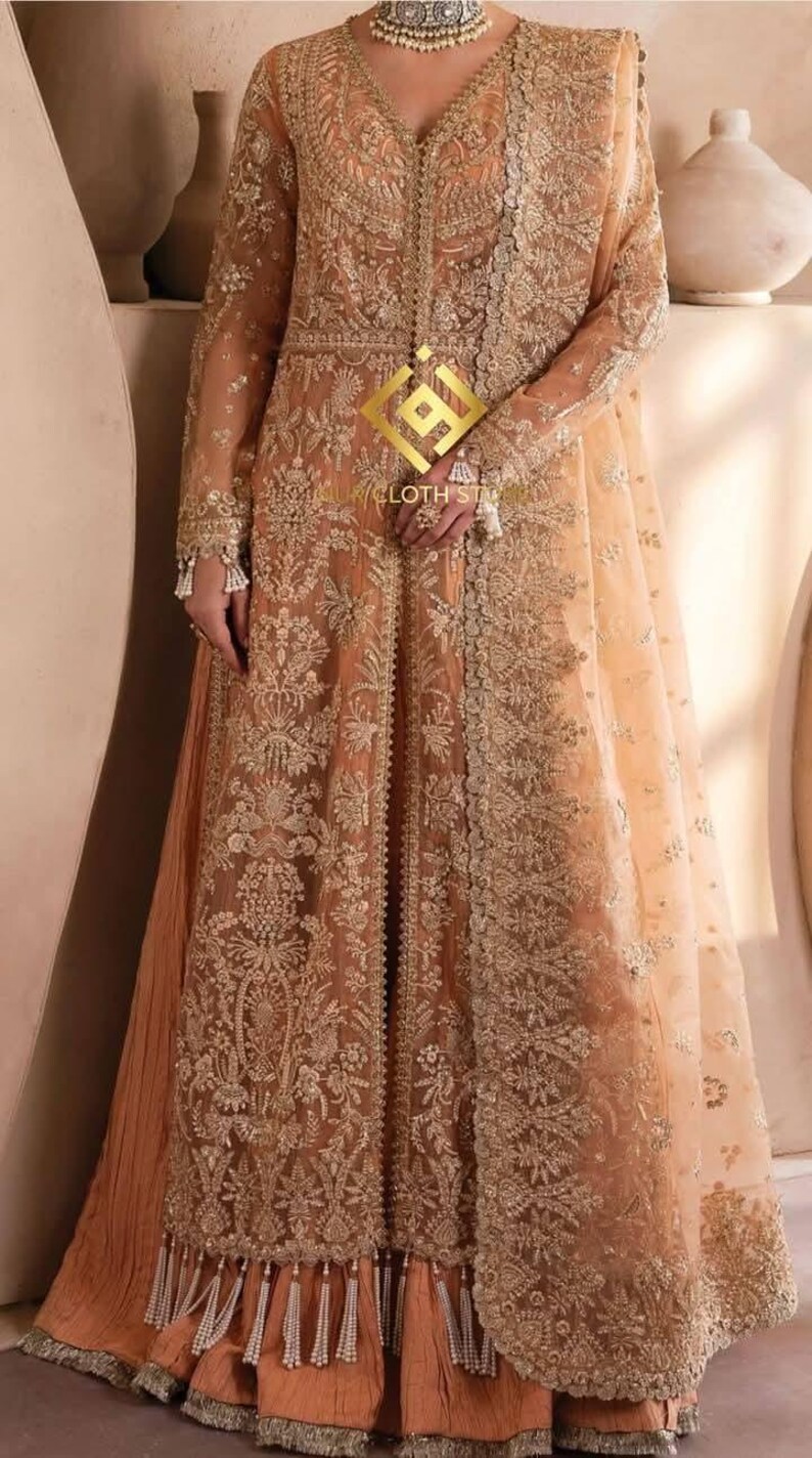 Silk Suit with Heavy Embroidery & Net Dupatta