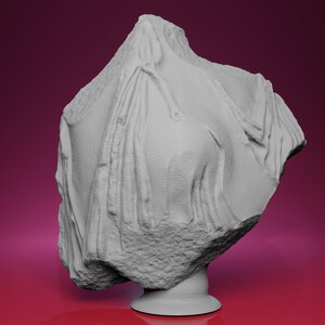 May include: A gray bust sculpture of a figure draped in fabric. The sculpture has a rough, textured appearance and sits on a round pedestal. The background is a gradient of pink and maroon.
