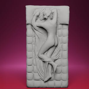 May include: A gray sculpture of a nude figure reclining on a tufted surface, possibly a bed or a cushion. The figure is lying on their side, with one arm raised above their head and draped in fabric. The sculpture is detailed and appears to be made of stone or a similar material.