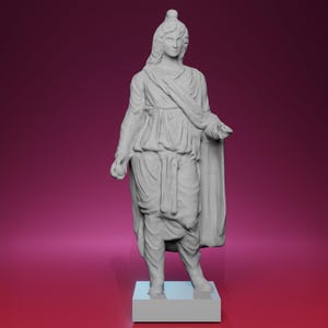 May include: A gray statue of a classical figure, standing on a white rectangular base. The figure is draped in flowing robes and a cape, with a helmet and long hair. The statue is holding an object in its left hand.