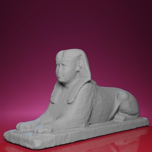 May include: A gray sculpture of a sphinx, a mythical creature with the body of a lion and the head of a human. The sphinx is lying down on a rectangular base, with its paws extended. The background is a gradient of red and purple.