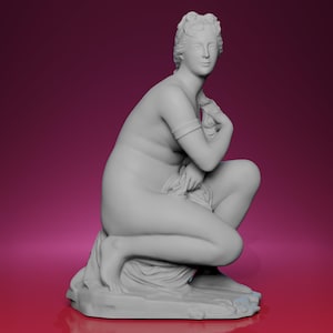 May include: A gray sculpture of a seated female figure, possibly a classical goddess or nymph. The figure is nude, with detailed facial features and hair. She is holding a cloth and is seated on a draped base.