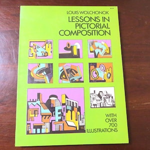 May include: A green book cover with the title "Lessons in Pictorial Composition" by Louis Wolchonok. The cover features colorful geometric illustrations and the text "With over 700 illustrations".