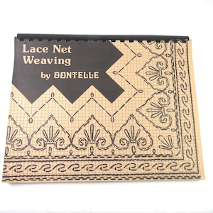 May include: A spiral-bound instructional book titled Lace Net Weaving by DONTELLE. The cover features a tan grid background with black printed illustrations of intricate lace patterns, including heart-shaped motifs and decorative borders.
