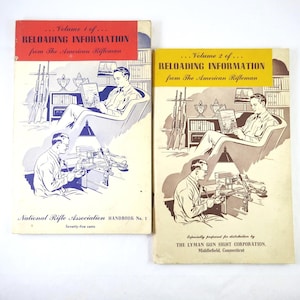 May include: Two vintage books titled "Reloading Information" from The American Rifleman. Volume 1 has a red banner, and Volume 2 has a yellow banner. Each cover features illustrations of men and firearms.