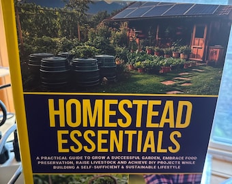 May include: A yellow book titled "Homestead Essentials" with a subtitle "A practical guide to grow a successful garden, embrace food preservation, raise livestock and achieve DIY projects while building a self-sufficient & sustainable lifestyle". The book cover features a photo of a garden with a small wooden building and a solar panel.