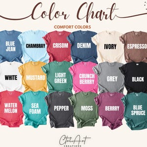 May include: A color chart displaying various Comfort Colors t-shirts. The shirts are arranged in rows and columns, showcasing a range of colors including blue jean, chambray, crisom, denim, ivory, espresso, white, mustard, light green, crunch berry, grey, black, watermelon, sea foam, pepper, moss, berry, and blue spruce.