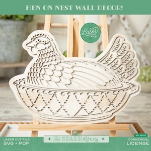 May include: A laser-cut wooden hen in a nest wall decor piece. The hen is light-coloured with detailed feather and wing designs. The nest has a diamond pattern. The text "HEN ON NEST WALL DECOR!" is at the top. The Spark Library logo is at the bottom.