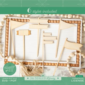 May include: A collection of six wooden sign toppers in various shapes, including flags and banners. The signs are arranged on a white tray with a beaded border. The text "6 styles included" is visible. The image also includes the text "Personalize IT", "LASER CUT FILE SVG • PDF", "The Spark Library", and "COMMERCIAL LICENSE".