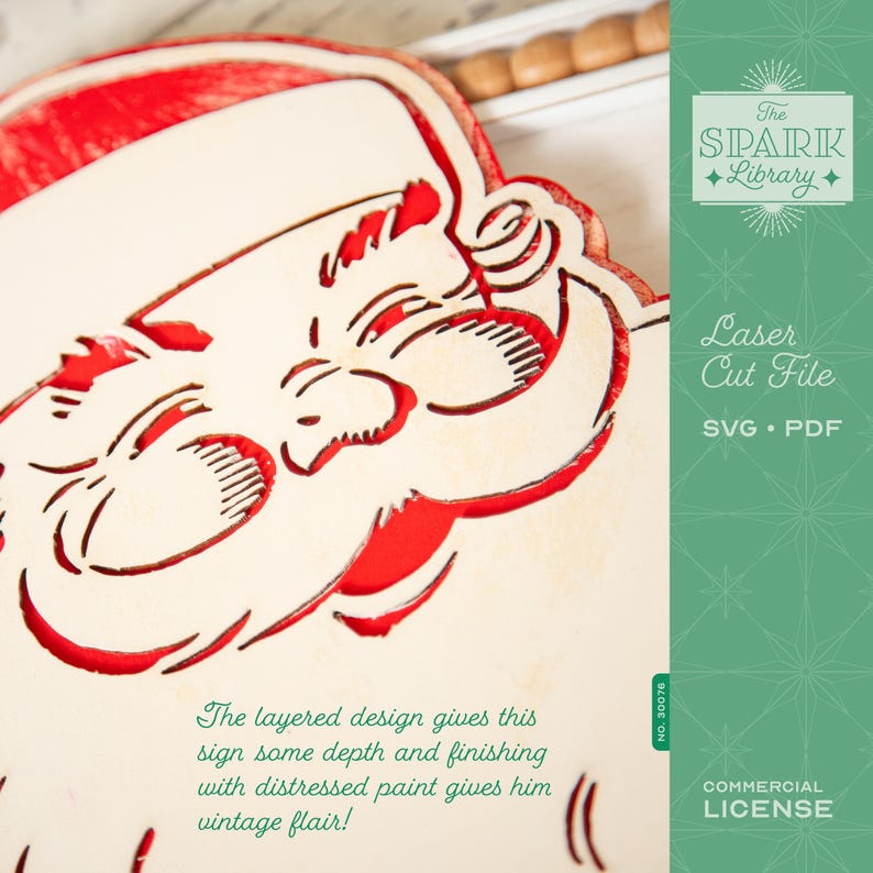 May include: A laser-cut Santa Claus design with a layered effect, featuring red and cream colors. The design includes the text "The layered design gives this sign some depth and finishing with distressed paint gives him vintage flair!"