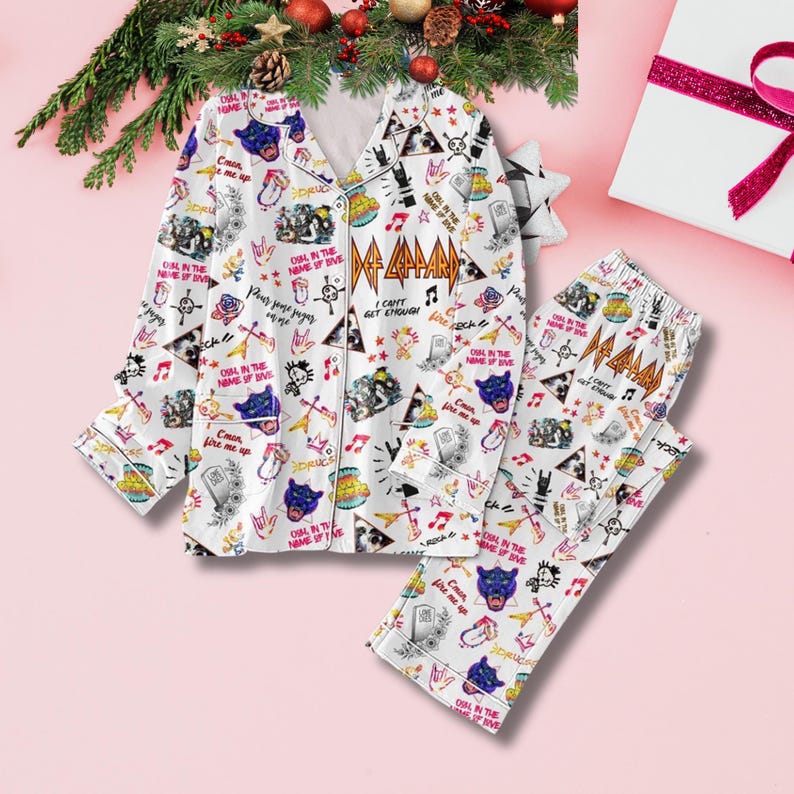 May include: White pajama set with a repeating pattern of musical instruments, rock band logos, and text. The long-sleeved top and pants feature the band's logo and phrases like "I can't get enough". The set is decorated with a Christmas theme.
