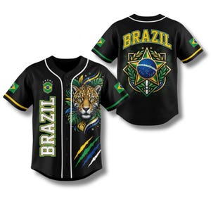 May include: Black baseball jersey with the word "BRAZIL" in white and green. The front features a jaguar's face and the Brazilian flag. The back displays "BRAZIL" and a Brazilian emblem. The sleeves have the Brazilian flag.