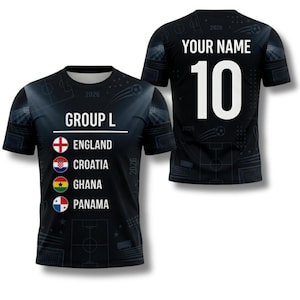 May include: Black soccer jersey with the text "GROUP L" and the flags of England, Croatia, Ghana, and Panama. The back of the jersey has the number 10 and the text "YOUR NAME". The year 2026 is printed on the jersey.