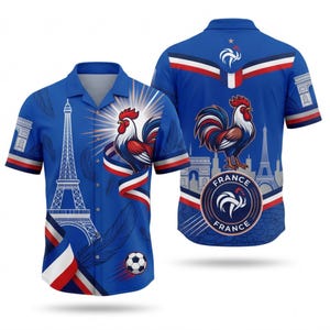 May include: Blue button-up shirt featuring a rooster, Eiffel Tower, and soccer ball design. The shirt has short sleeves and a collar. The back of the shirt also features a rooster and the Eiffel Tower. The shirt has red, white, and blue accents.