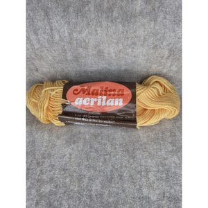 May include: A skein of yellow Malina Acrilan knitting yarn. The label indicates the yarn is 7 oz / 85 grams, a Dupont Orlon acrylic, and is machine washable. The yarn is a light, pastel yellow color.