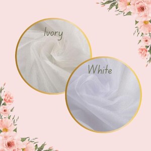 May include: Two samples of sheer fabric, one ivory and one white, are displayed in gold-rimmed circles. The word "Ivory" is written above the ivory sample, and "White" above the white sample. Floral arrangements frame the image.