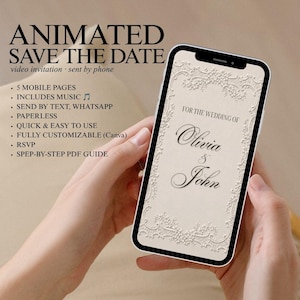 May include: A smartphone displaying a digital wedding invitation with a cream-coloured background and an ornate white lace border. The screen features the text FOR THE WEDDING OF Olivia & John in a black serif font. The design is elegant and formal.